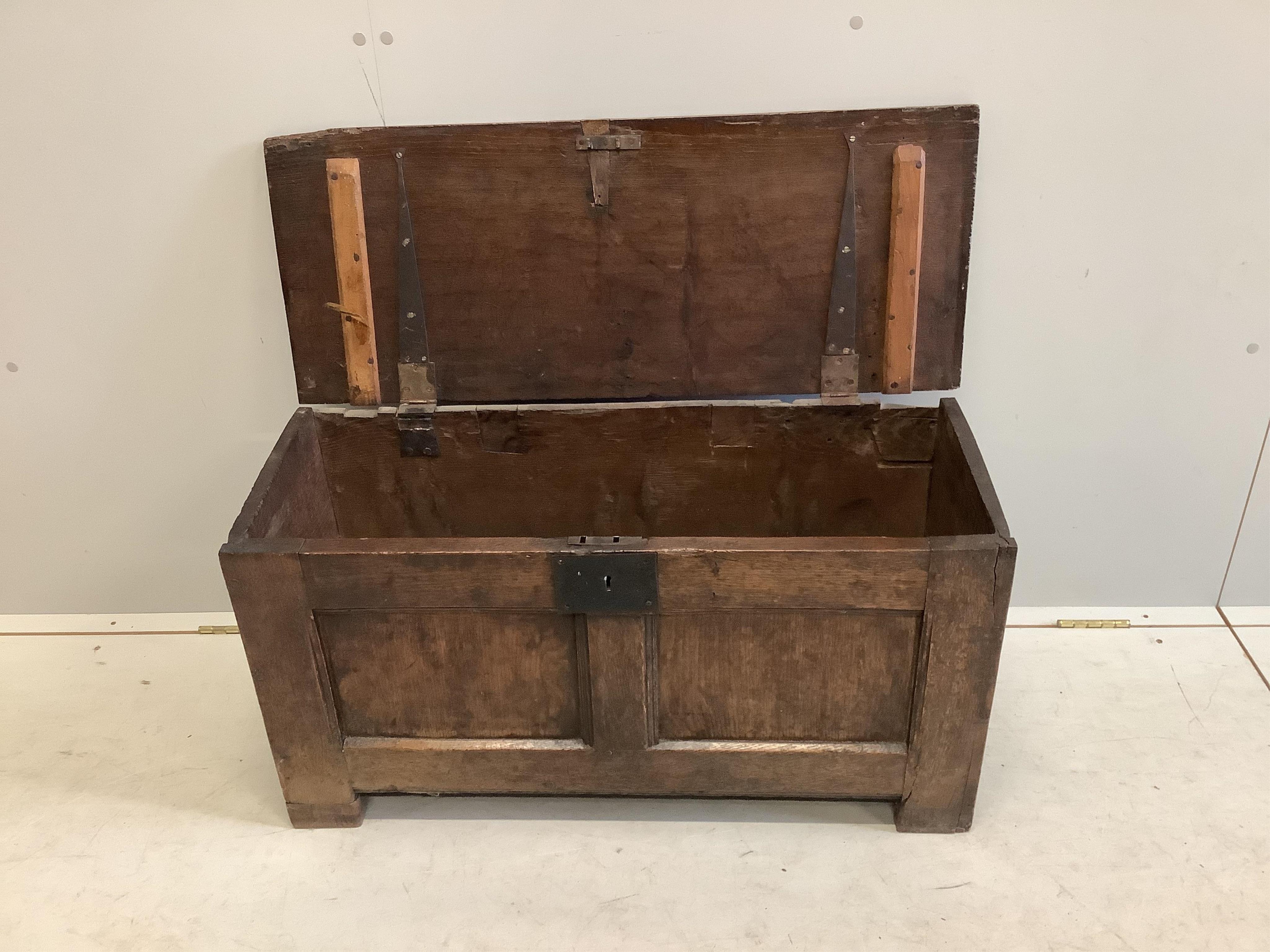 A small early 18th century panelled oak coffer, width 90cm, depth 36cm, height 47cm. Condition - fair